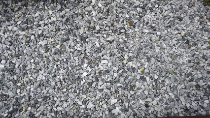 scattered small gray stones on all photos