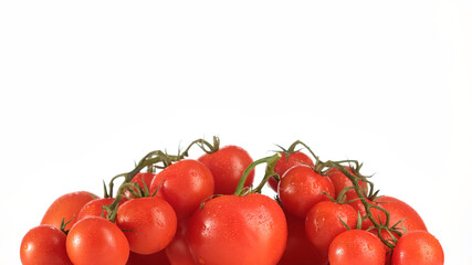 fresh ripe tomatoes and cherry tomatoes on white background close up
