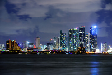 Miami skyline. Miami business district, lights and reflections of the city.