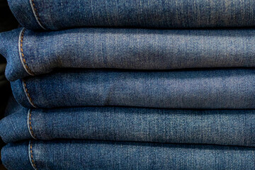 Folded and overlapping jeans front view 5520