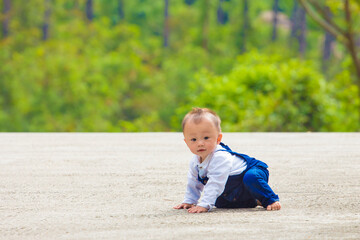 A baby learns to walk and take a full body photo