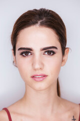 Portrait of a woman with make-up on a white background, make-up concept