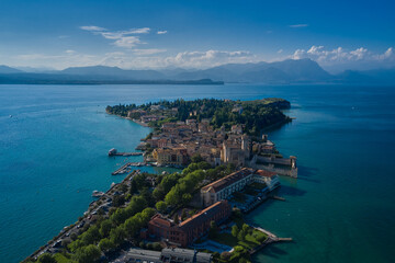 Naklejka premium Castle Rocca Scaligera in Sirmione, Garda Lake. View by Drone. Panoramic aerial view of the historic city of Sirmione