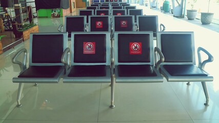 waiting chairs that are given stickers Social Distancing