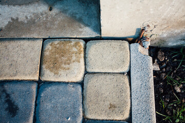 Perspective View Monotone Gray Brick Stone Pavement on The Ground for Street Road. Sidewalk, Driveway, Pavers, green grass