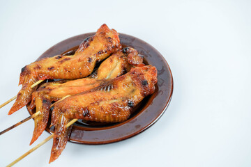 Chicken wing skewer grill photo on white background