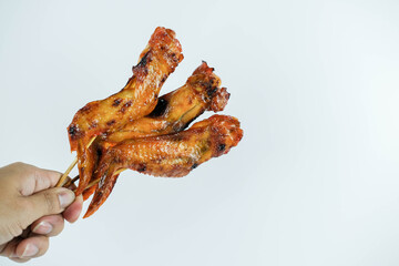 Chicken wing skewer grill photo on white background