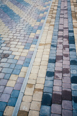 Perspective View Monotone Gray Brick Stone Pavement on The Ground for Street Road. Sidewalk, Driveway, Pavers, green grass