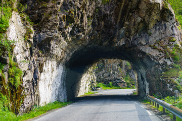 Obraz premium Road with tunnel in mountains Norway