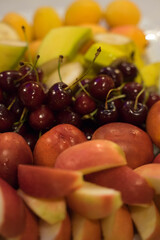 fruits lie on a white plate on the table