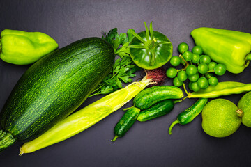 Top view zucchini corn grapes cucumber pepper walnut.