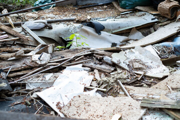 Old broken building materials in nature, demolition waste