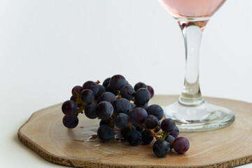 Isolated grape and wine. Alcoholic beverage product, space for text