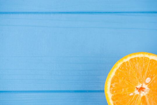 Top Above Overhead View Close-up Photo Of Orange Slice Isolated On Blue Wooden Background With Copyspace