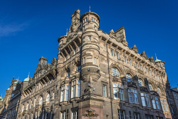 Fototapeta na wymiar Histroic building on the corner of North Birdge and High Street in the Old Town of Edinburgh city, Scotland, UK