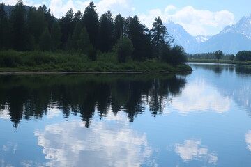 Reflective lake and Mount Moran in the Tetons