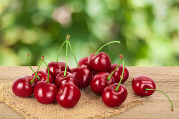 red sweet cherry on wooden table isolated on white background with clipping path and full depth of field