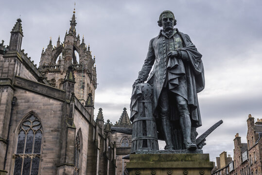 Monument to the Adam Smith in front of Saint Giles cathedral in the Old Town of Edinburgh city, Scotland, UK