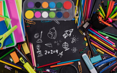 Back to School Concept with Stationery and Blackboard