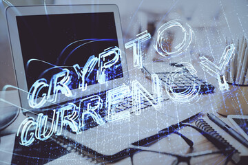 Double exposure of blockchain and crypto economy theme hologram and table with computer background....
