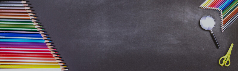 Colorful pencils close up shooting and Back to School Concept with Stationery and Blackboard