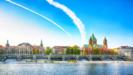Fototapeta premium Fantastic autumn view on Saint Lucas Church (Lukas kirche), the largest Protestant church in Munich, and Isar River