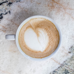Italian cappuccino coffee cup on marble table surface