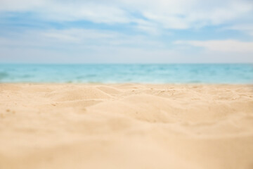Fototapeta na wymiar Beautiful sandy beach and sea on sunny day, closeup. Summer vacation