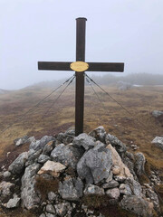 a cross on the mountains top