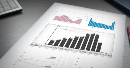 Financial data on paper lying on an office table. Graphs, Diagram, Information