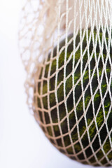 Watermelon is in string mesh cotton eco bag. Delivery concept. 