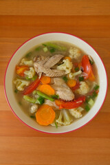 Chicken soup in a bowl.