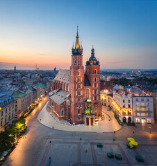 Krakow, Poland. Aerial view of illuminated St. Mary's Basilica (Bazylika Mariacka) on sunrise