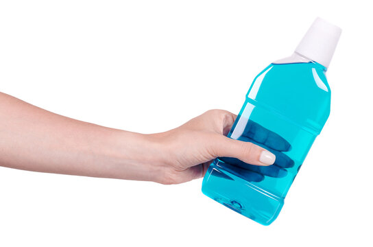 Hand With Liquid Mouth Wash In Plastic Bottle. Isolated On White Background.