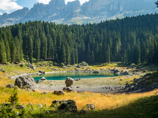 Karersee below the Karerpass at the foot of the Latemar massif