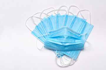 coronavirus COVID-19 pandemic concept - stack of antiviral surgical protective medical mask for protection against corona virus