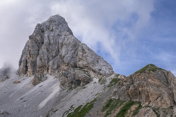 View of Grosse Kinigat/Monte Cavallino mountain and Hintersattel pass as seen from Filmoor / Standschutzenhutte refuge below, Carnic Highroute Trek, Carnic Alps, Austria.