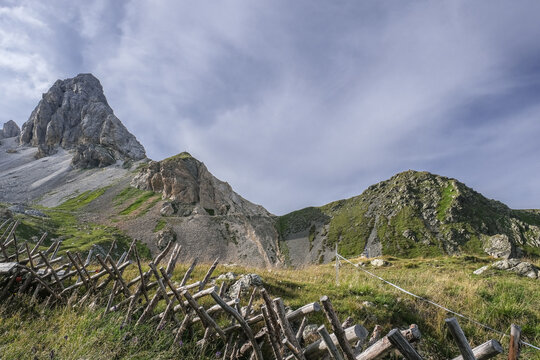 View of Grosse Kinigat/Monte Cavallino mountain and Hintersattel pass as seen from Filmoor / Standschutzenhutte refuge below, Carnic Highroute Trek, Carnic Alps, Austria.