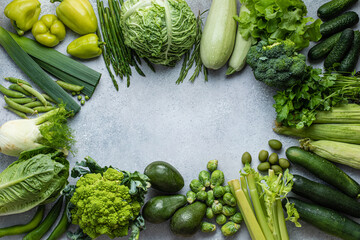 Flat lay of green vegetables collection on gray background. Flat-lay, top view. Healthy food.