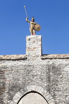 Door of the city with the baboin statue in the village of Chazay-d'Azergues in Beaujolais, France