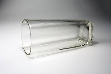 Empty glass Lying on a white background.