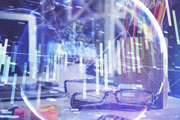 Business theme hologram with glasses on the table background. Concept of search. Double exposure.