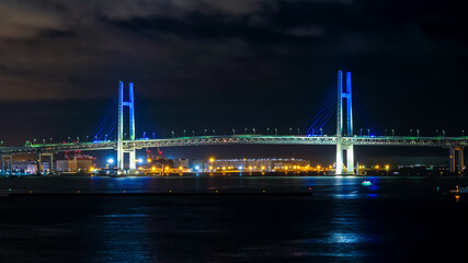 Fototapeta na wymiar 横浜ベイブリッジの夜景 青色のライトアップ