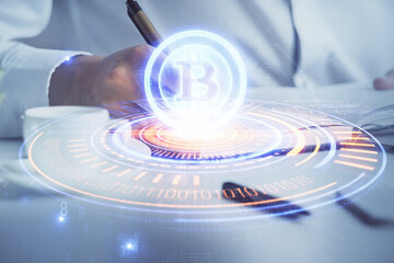 Man's hands working with notes background. Cryptocurrency and finance concept.