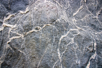 Fototapeta na wymiar Texture of black and white alternating granite