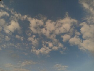 Fototapeta na wymiar white clouds against a blue sky background