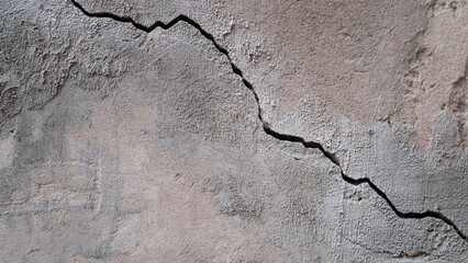 Fototapeta premium Building wall concrete surface. Crack. Background image for web design. 