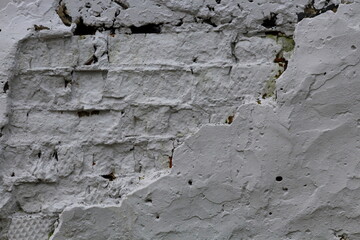 Texture of brick old painted and plastered wall