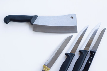 A group of knives of different sizes on white ground,close up