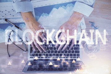 Blockchain theme hud with man working on computer on background. Concept of crypto chain. Double exposure.